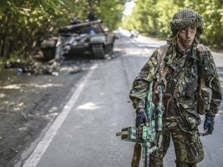Separatist/Russian fighter in front of Ukrainians he ambushed